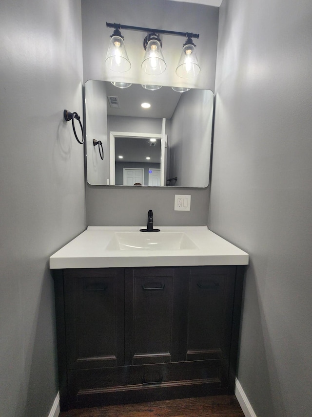 bathroom featuring vanity and hardwood / wood-style flooring