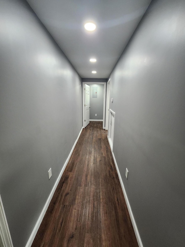 hallway with wood-type flooring