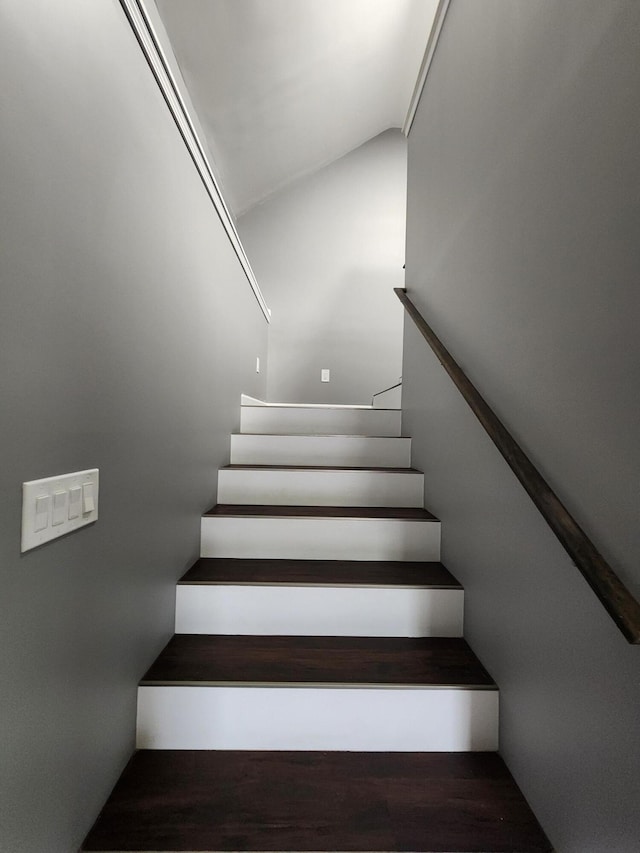 stairs featuring hardwood / wood-style flooring