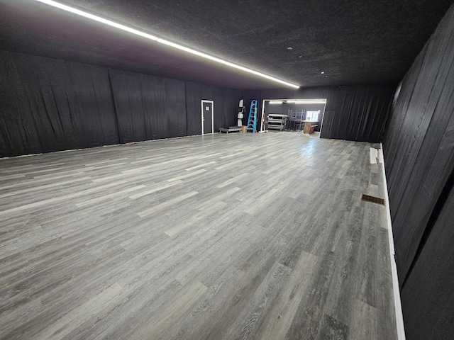 basement featuring hardwood / wood-style flooring