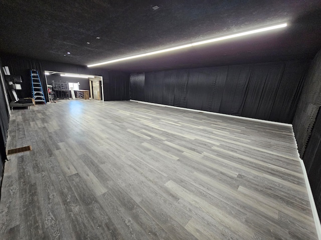 basement featuring hardwood / wood-style flooring