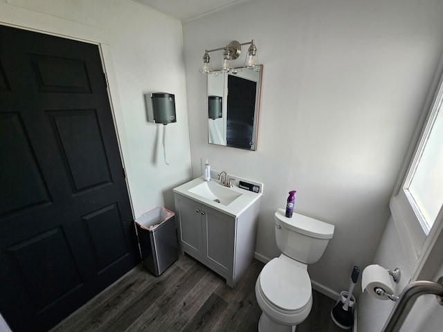 bathroom with vanity, hardwood / wood-style flooring, and toilet