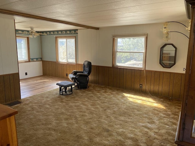 unfurnished room featuring ceiling fan and carpet flooring