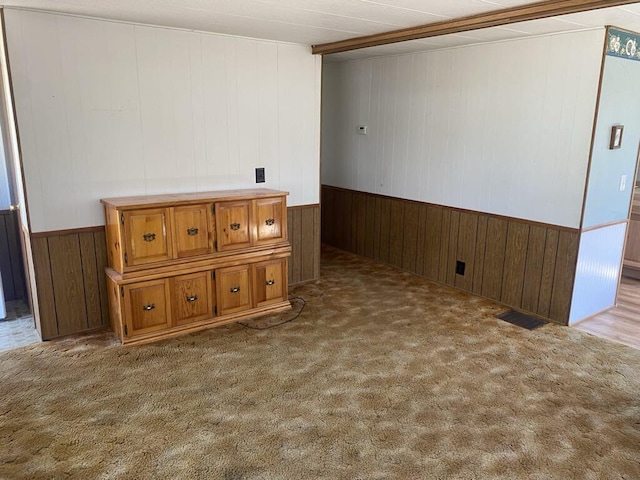 spare room with light colored carpet