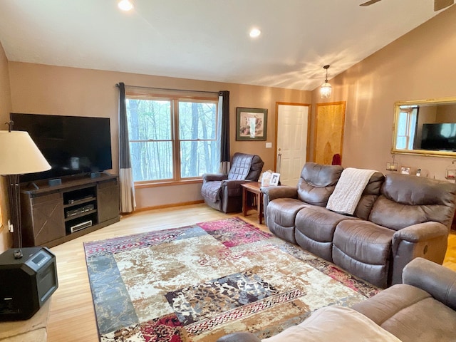 living room featuring hardwood / wood-style floors and lofted ceiling