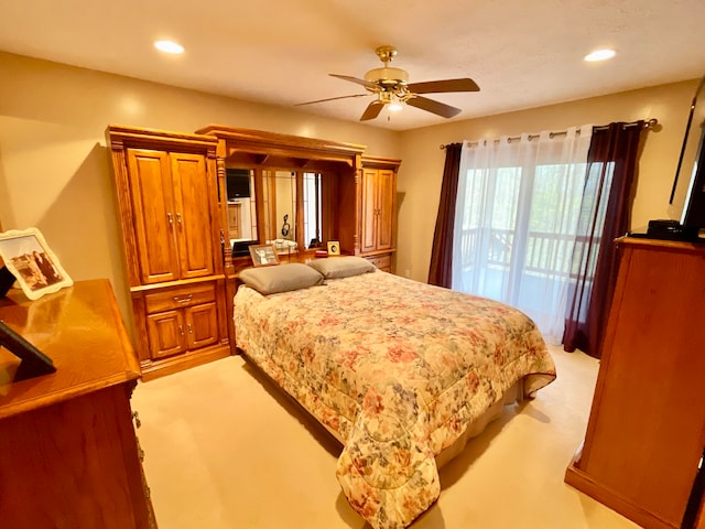 bedroom with light colored carpet, ceiling fan, and access to outside