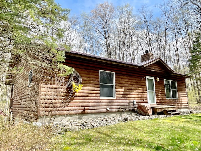 rear view of house with a lawn