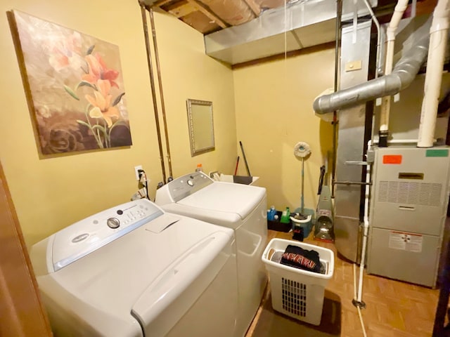 laundry area with independent washer and dryer