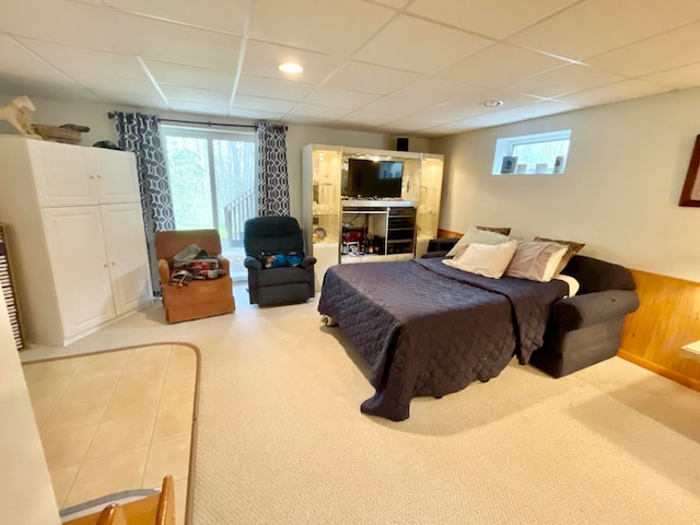 bedroom featuring a paneled ceiling and carpet floors