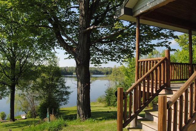 wooden deck featuring a water view