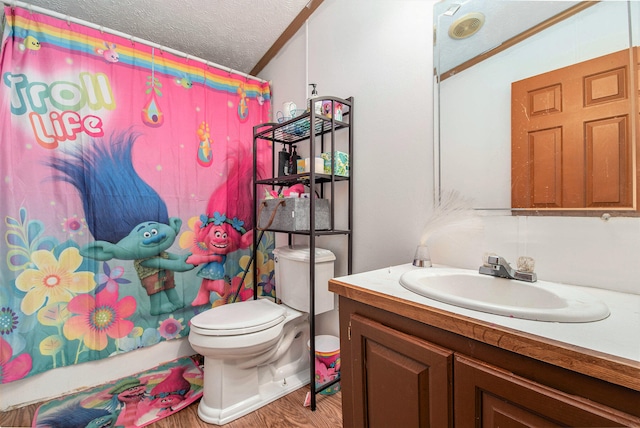 bathroom featuring a textured ceiling, vanity, toilet, and hardwood / wood-style floors