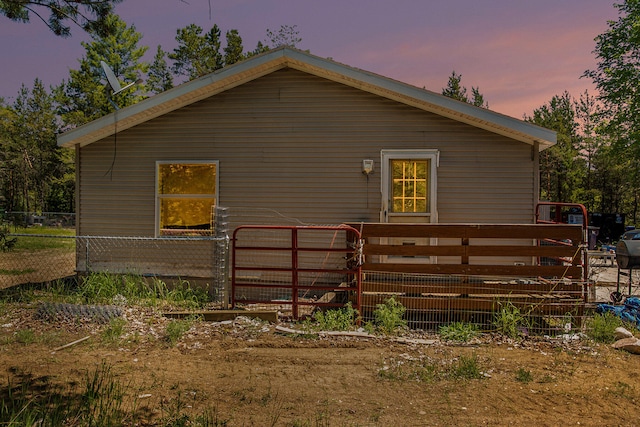 property exterior at dusk with a deck