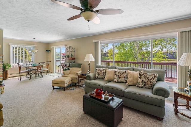 carpeted living room with ceiling fan, a textured ceiling, and a baseboard radiator