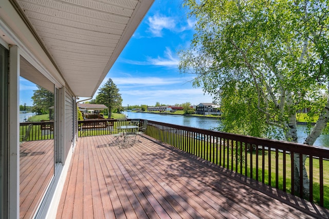 wooden terrace with a water view