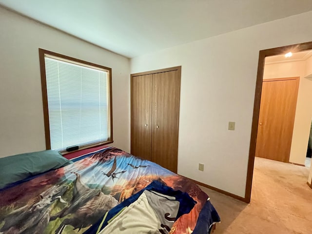 bedroom with light colored carpet and a closet