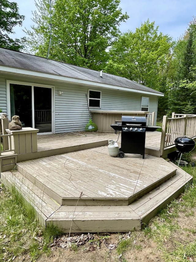 wooden terrace with area for grilling