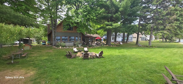 view of yard with an outdoor fire pit