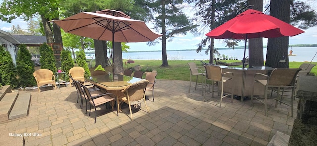 view of patio / terrace with a water view