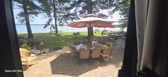 view of patio / terrace with a water view