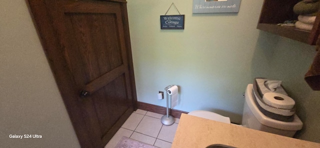 bathroom featuring toilet and tile patterned floors