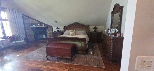 bedroom featuring lofted ceiling and dark hardwood / wood-style flooring