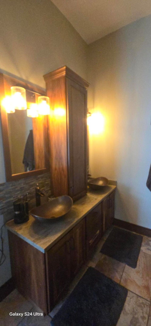 bathroom with vanity and backsplash