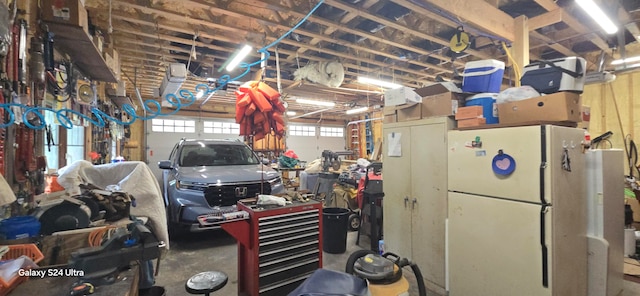 garage featuring white refrigerator