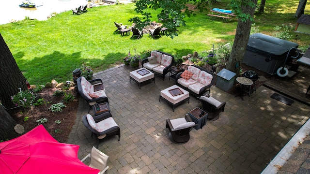 view of patio / terrace featuring an outdoor living space with a fire pit and a grill