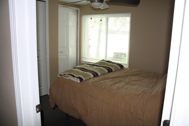 carpeted bedroom with ceiling fan