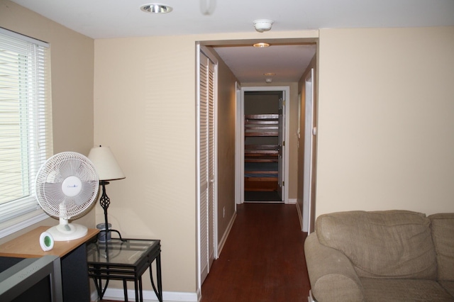 corridor featuring dark hardwood / wood-style flooring