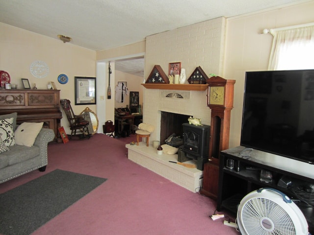 carpeted living room with a textured ceiling and a fireplace