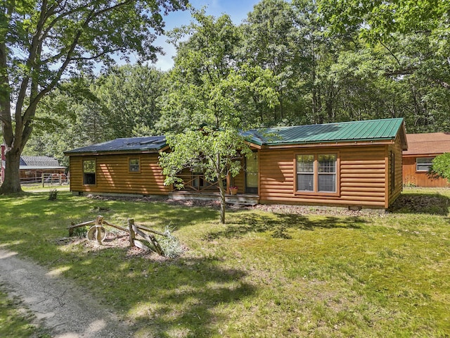 back of house featuring a yard