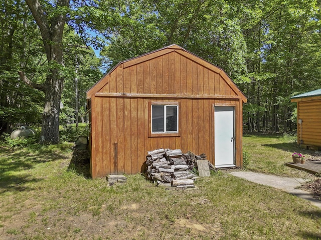 view of outdoor structure with a lawn