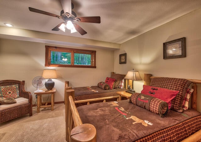 bedroom featuring ceiling fan and carpet floors