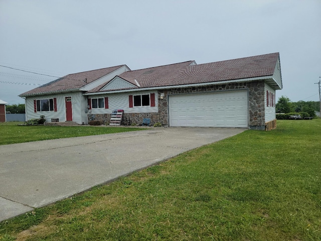 ranch-style home with a front yard and a garage