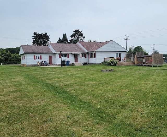 rear view of house with a lawn