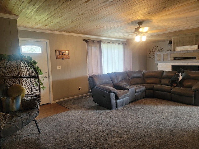 living room with ceiling fan, ornamental molding, and wooden ceiling