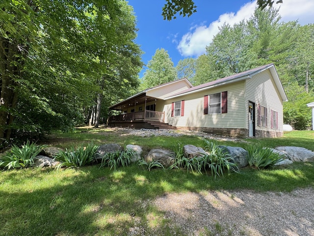 view of property exterior with a yard