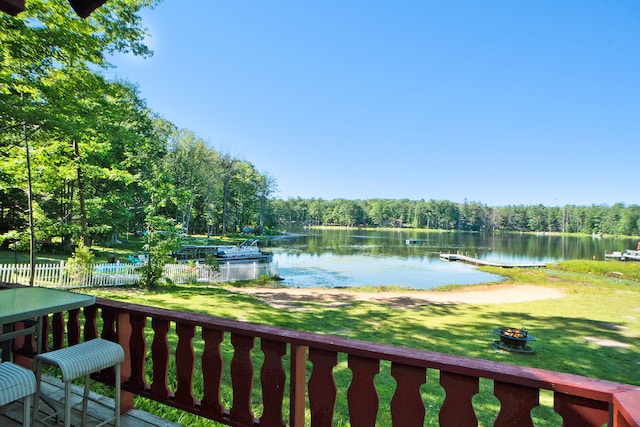 exterior space featuring a yard and a water view