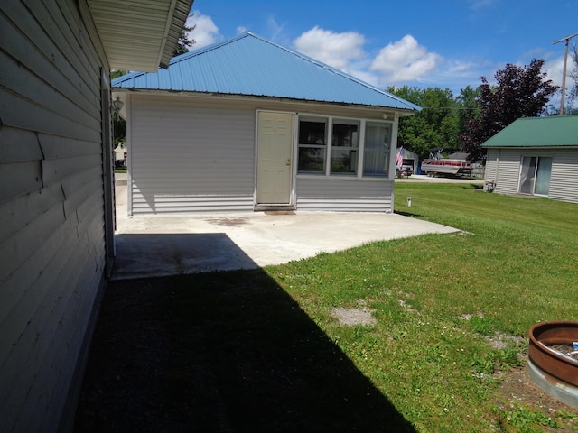 exterior space featuring a patio area and a yard