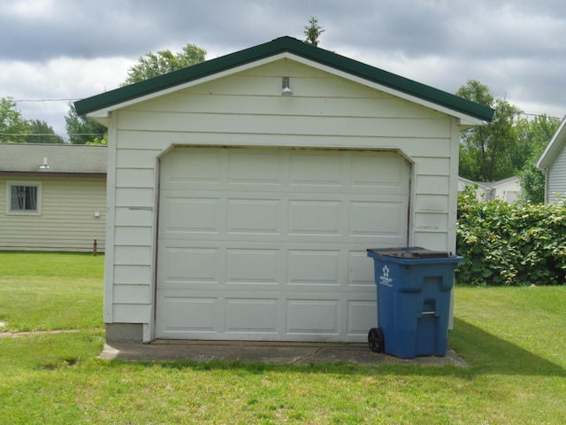 garage featuring a lawn