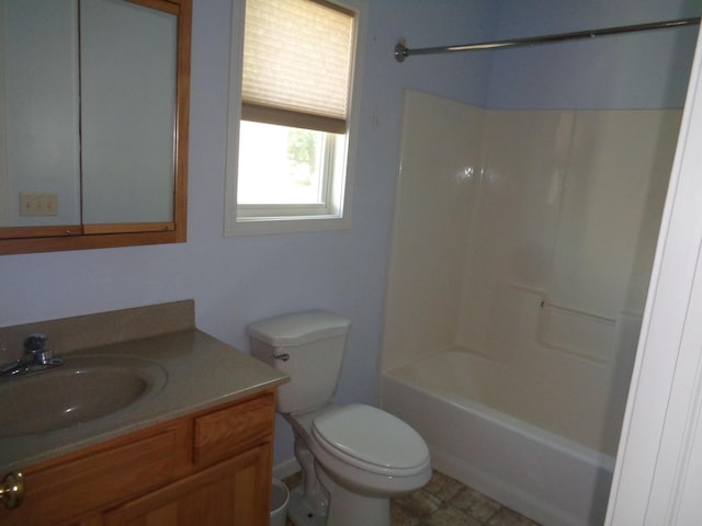 full bathroom with bathtub / shower combination, vanity, and toilet