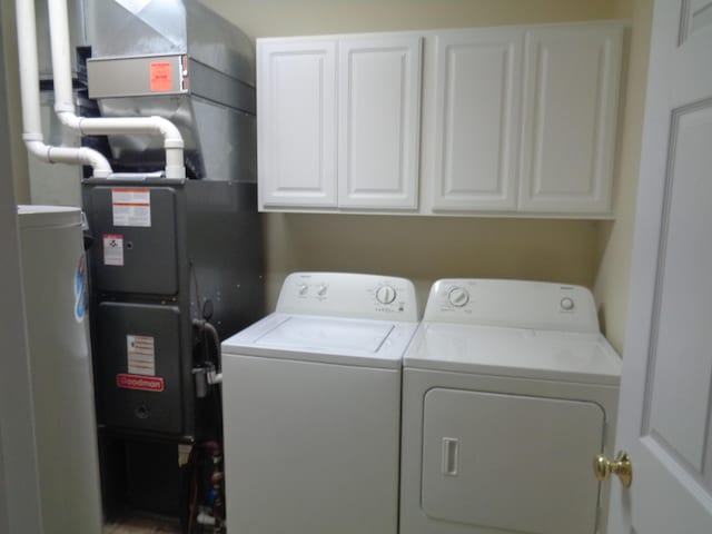 laundry area with cabinets and washer and dryer