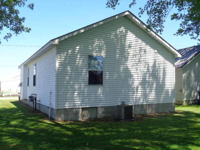 view of property exterior with cooling unit and a yard