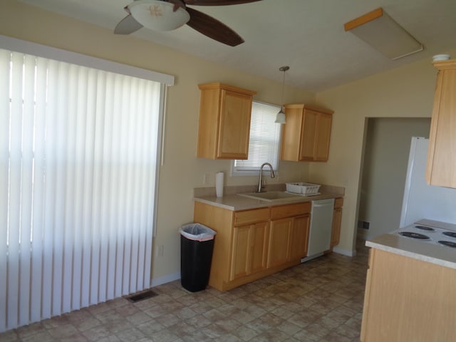 kitchen featuring ceiling fan, sink, hanging light fixtures, white appliances, and light brown cabinetry