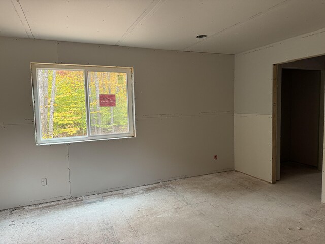 additional living space featuring lofted ceiling