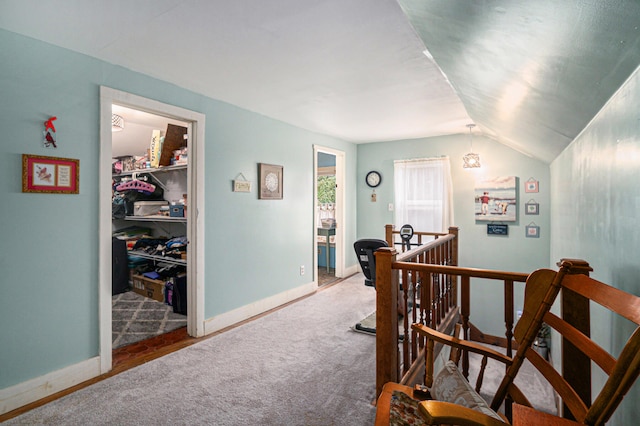 interior space featuring carpet floors and vaulted ceiling