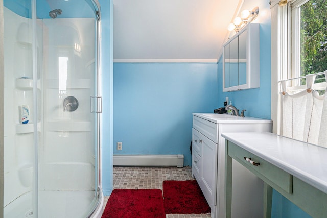 bathroom with tile patterned floors, a baseboard radiator, vanity, and an enclosed shower