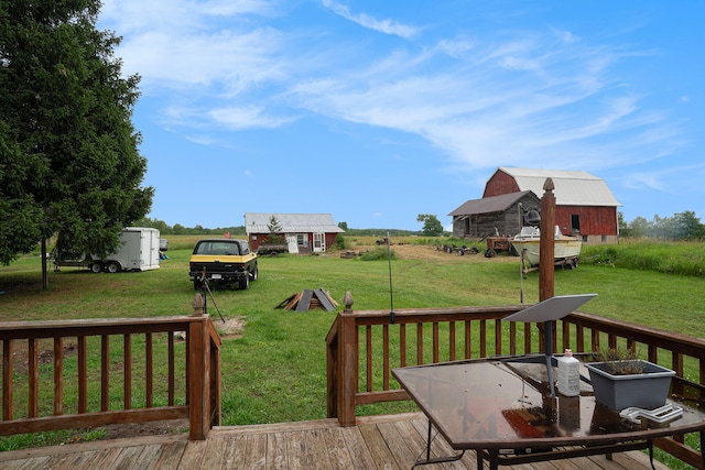 deck with a lawn and a shed