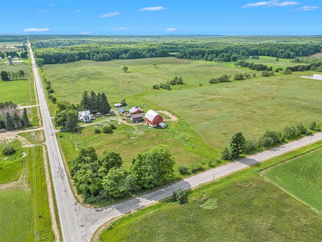 birds eye view of property with a rural view